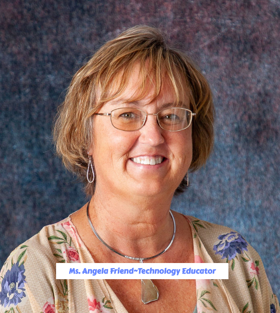 A woman wearing glasses and a dragonfly necklace smiles for the camera