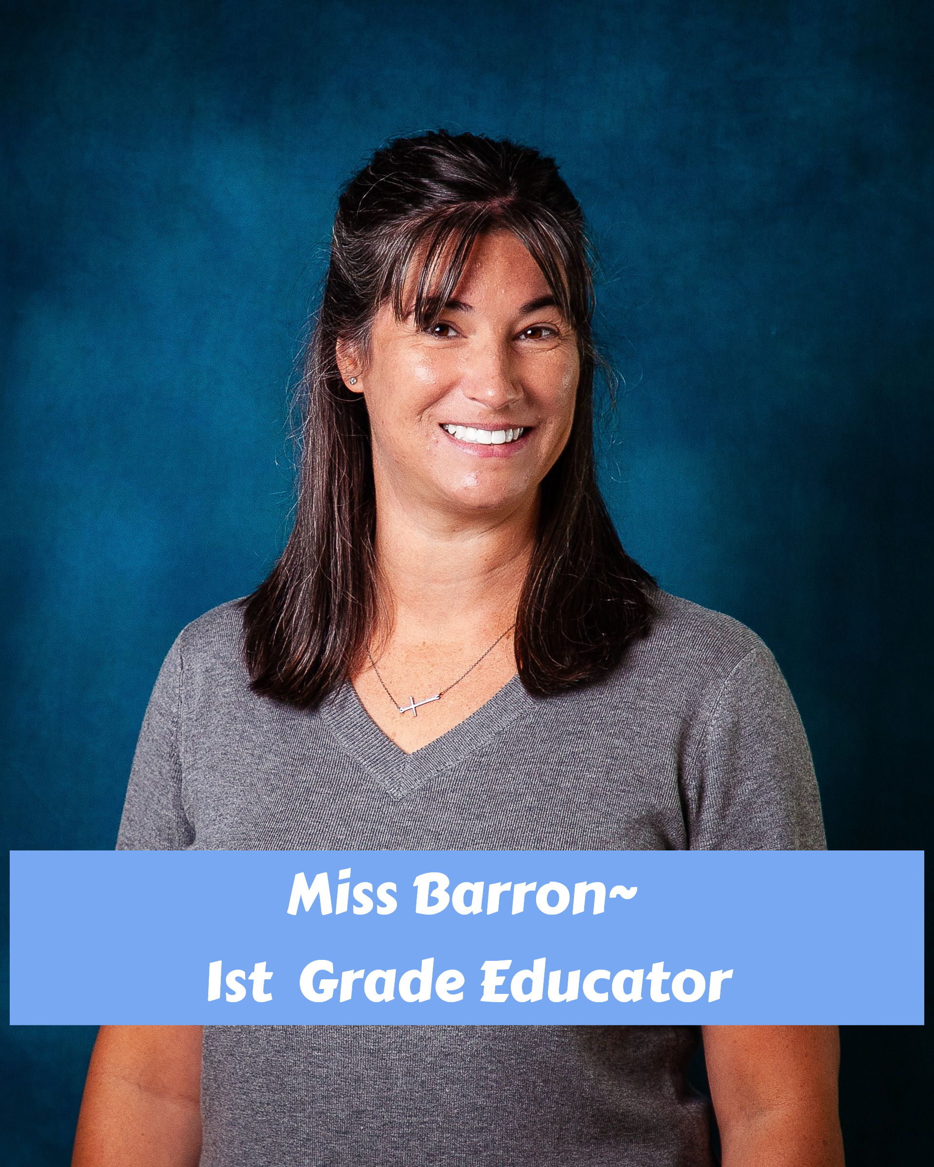 A woman in a floral shirt is smiling for the camera