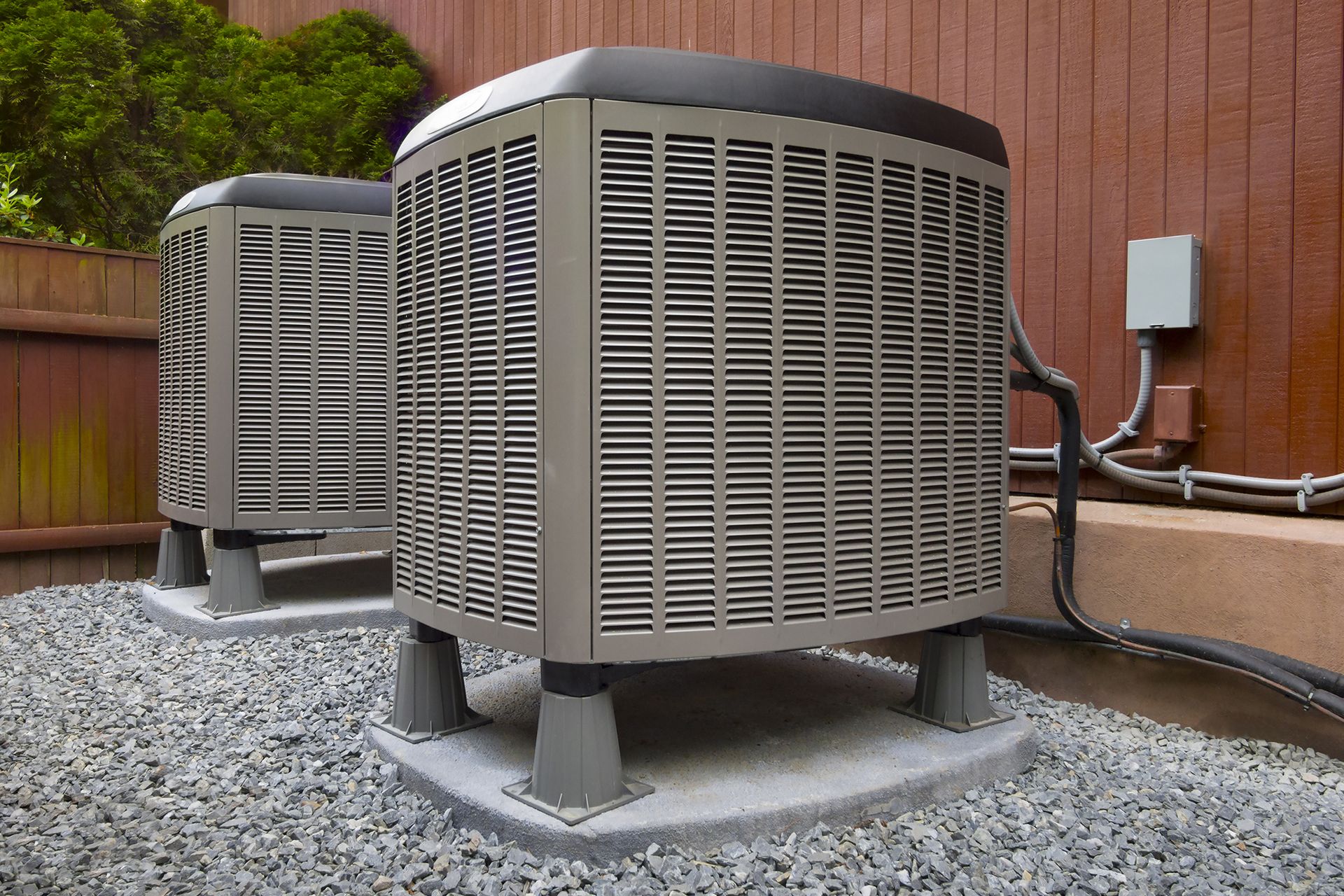Two Air Conditioners Outside the House