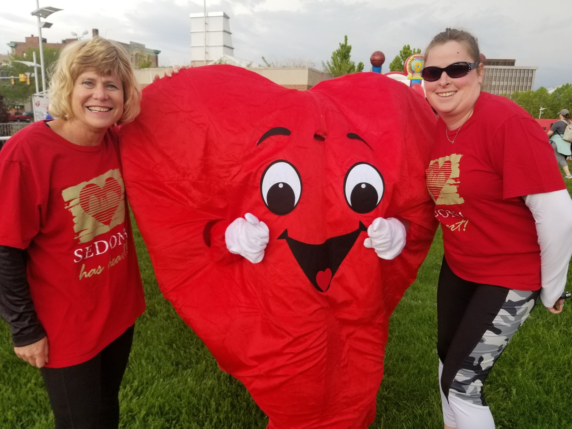 Sedona team poses with the mascot for the annual Heart Walk.