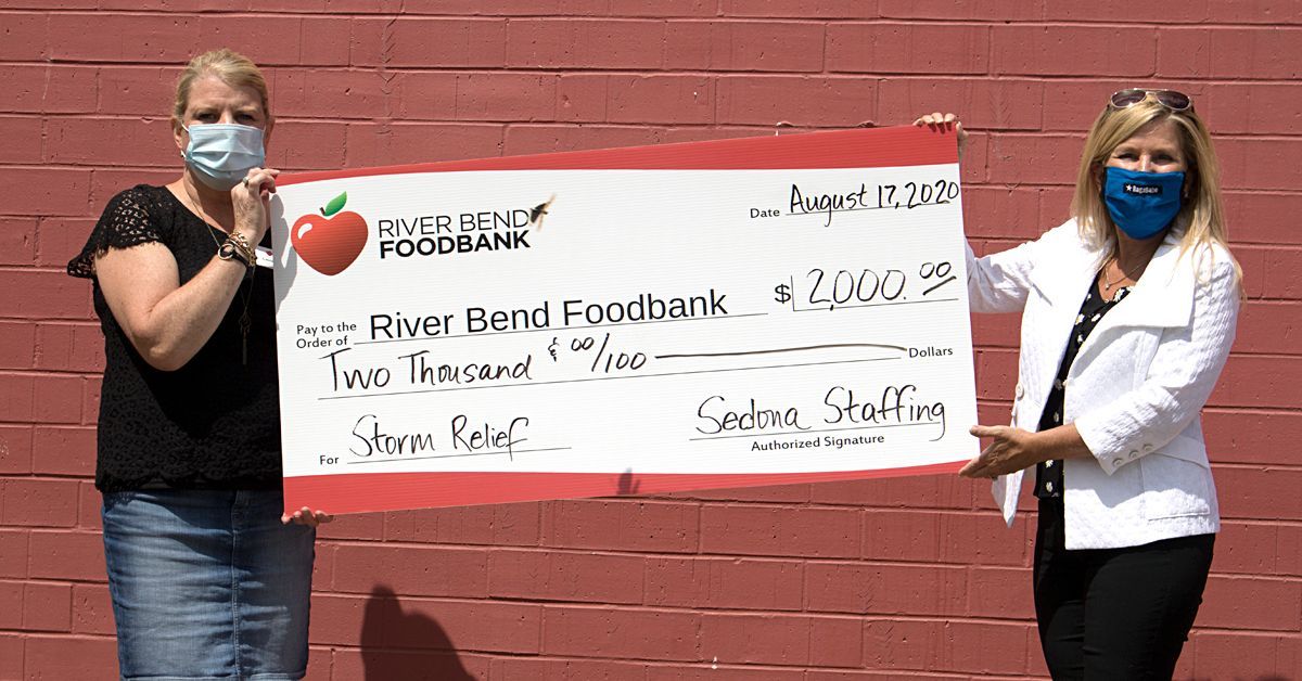 Sedona presents a $2,000 check to the Riverbend Foodbank.