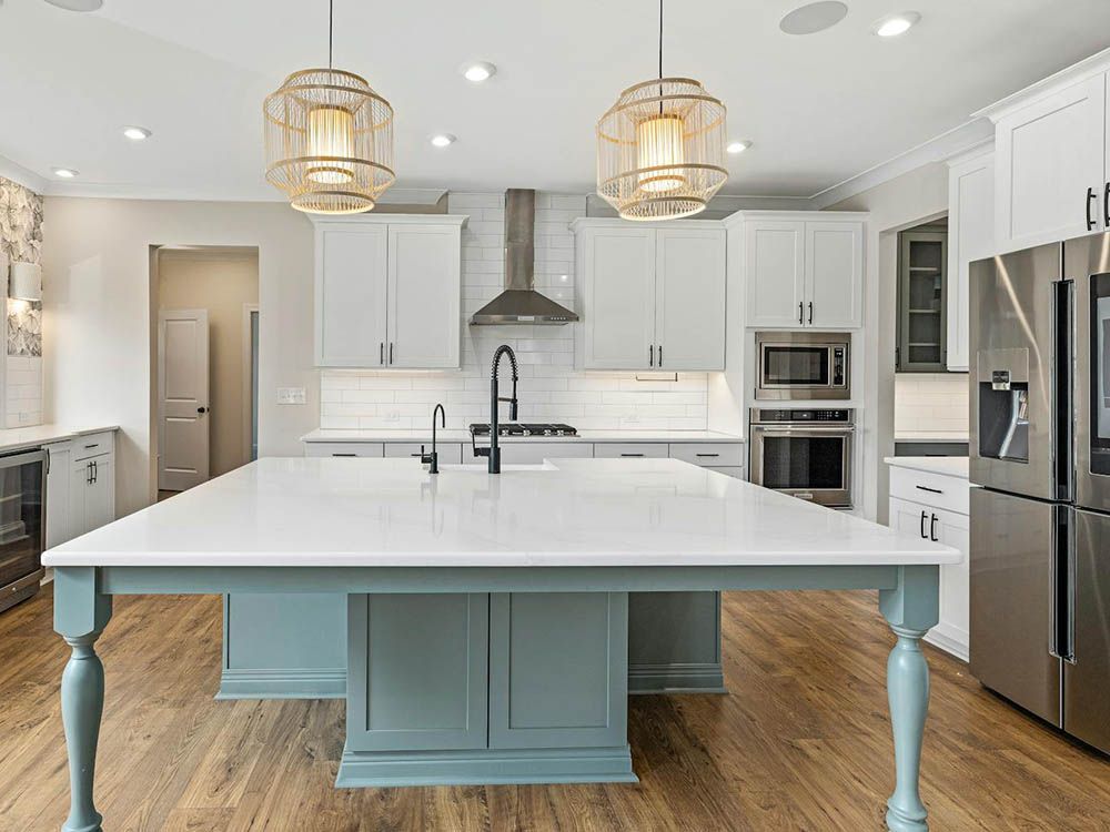 There is a large island in the middle of the kitchen.