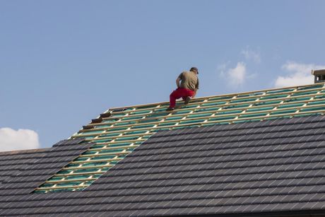 roofer contractor installing roof