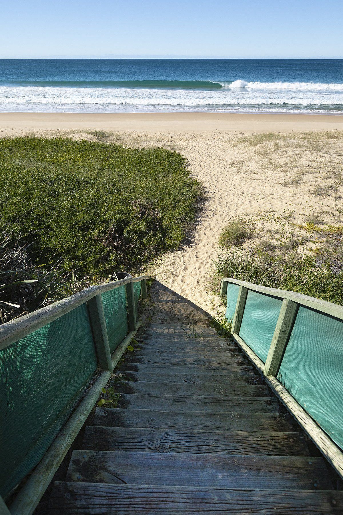 wooden walkway leading to a beach