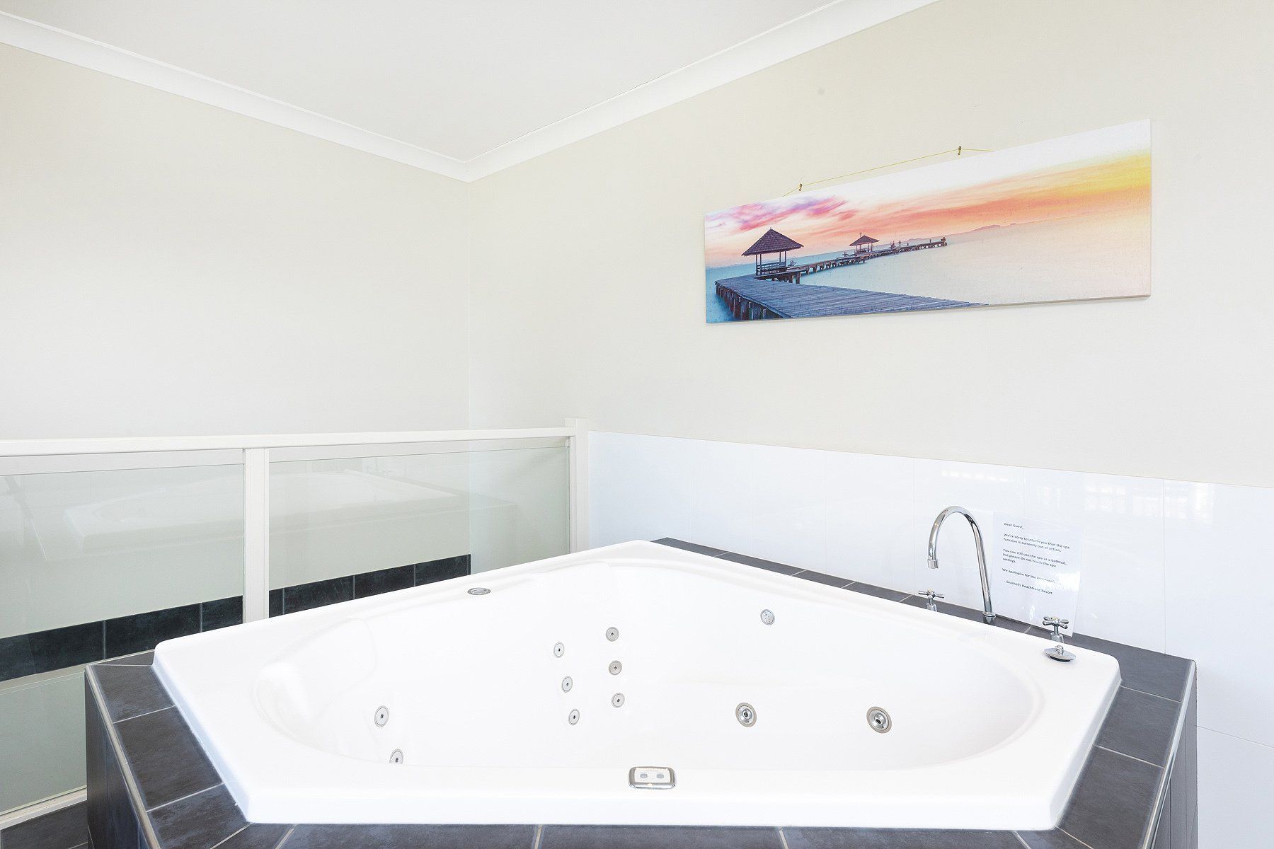 bathroom with hot tub