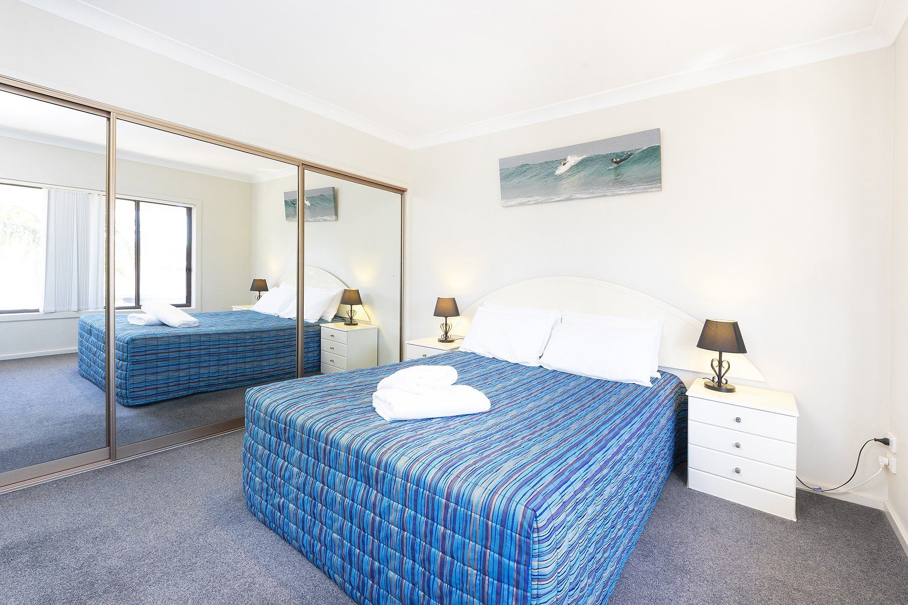 bed with blue mattress