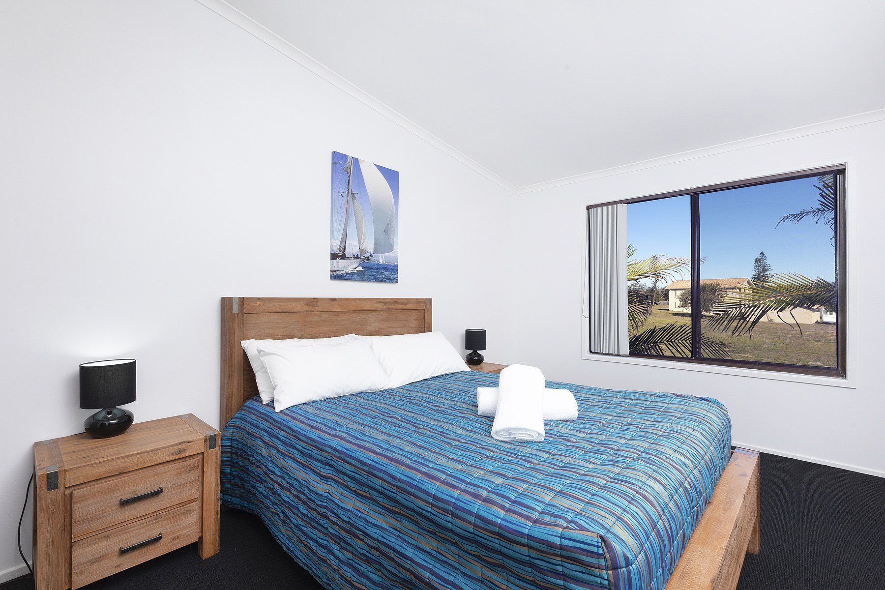 2 bedroom apartment with towels on bed