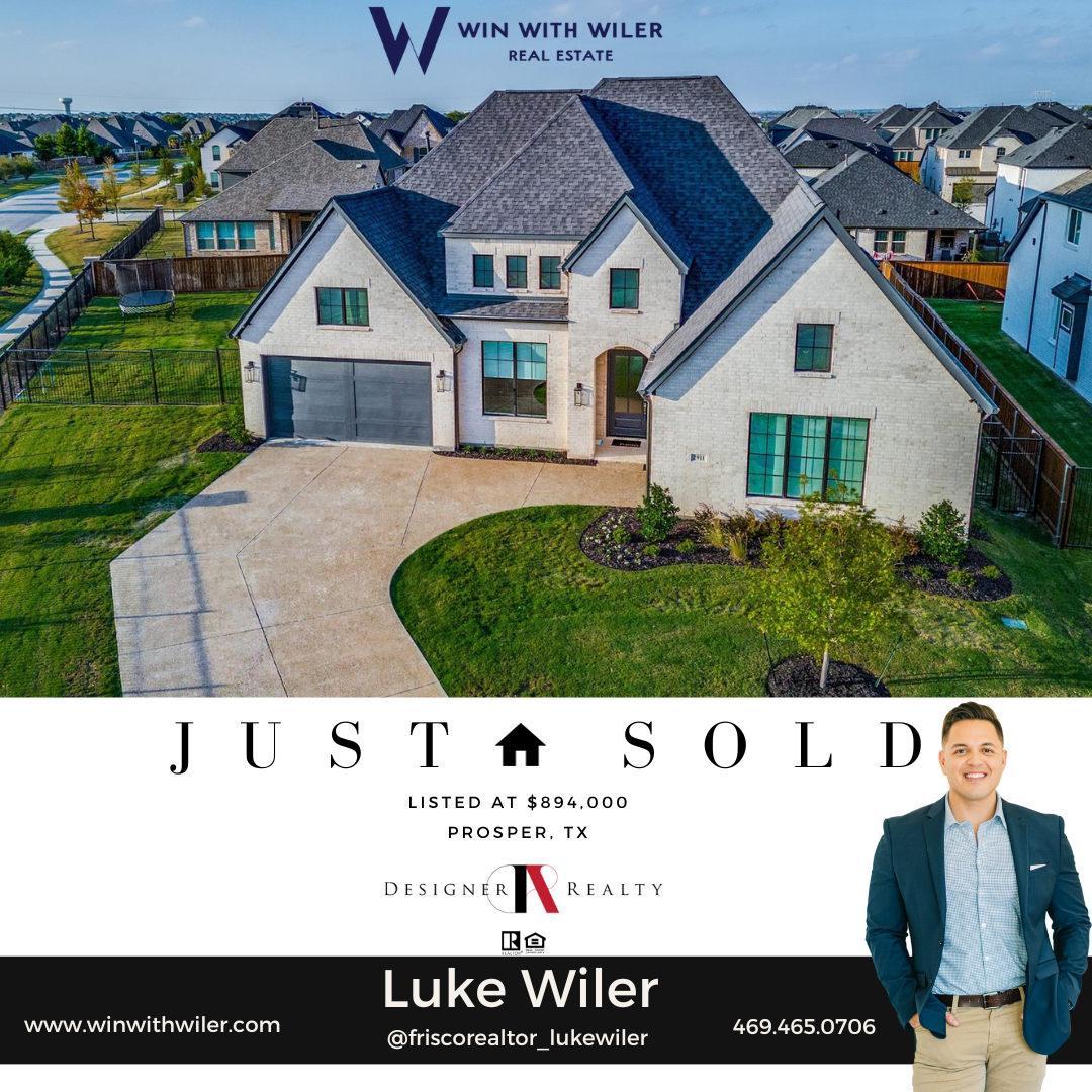 Luke Wiler standing in front of a house that has just been sold