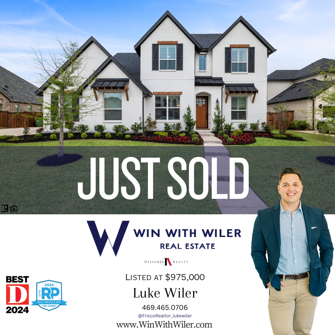 Luke Wiler is standing in front of a house that has just sold