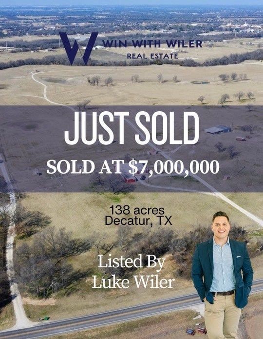 Luke Wiler in a blue jacket is standing in front of a field that is just sold