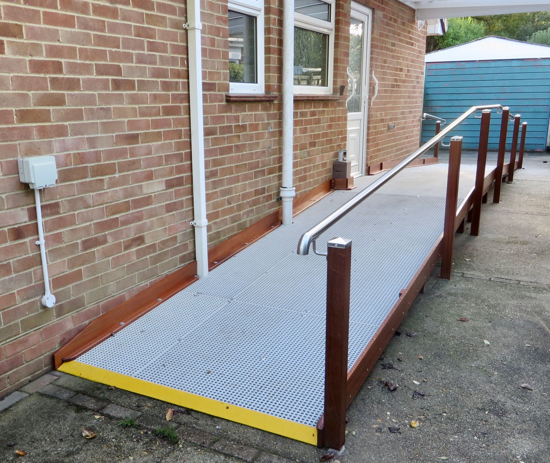 An Up & Over Ramp System to be enable a mobility scooter to be parked
outside the door