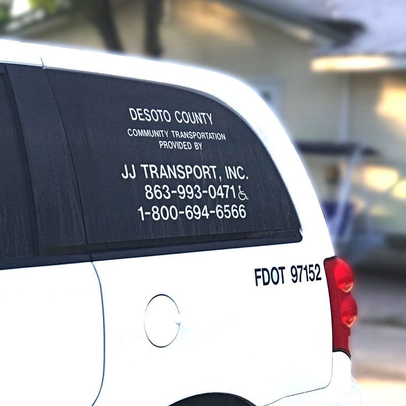 View of contact detail of J J Transport of Arcadia Inc on car mirror
