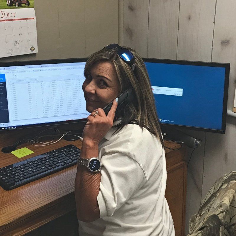 young woman listening to a call at J J Transport of Arcadia Inc