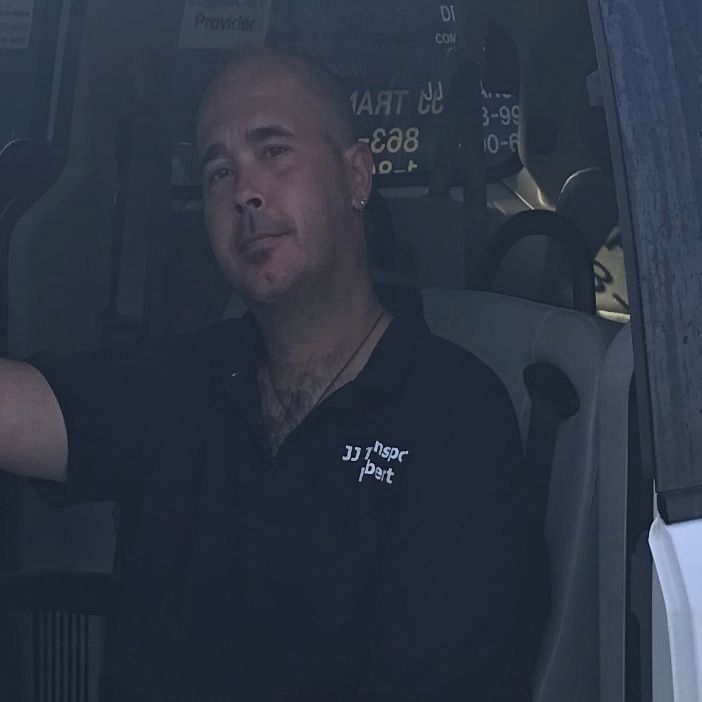 View of a man sitting at the driver seat