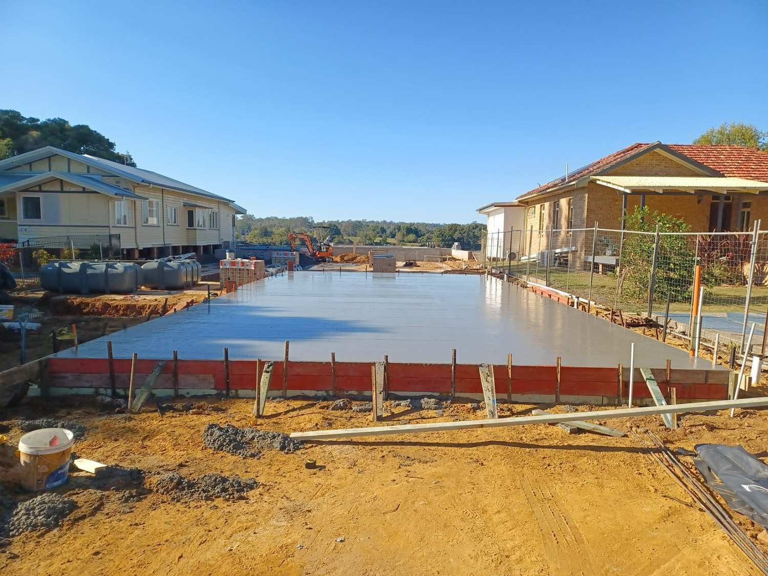 A Large Concrete Slab is Being Built in Front of a House — Brocksolid Concrete in Pillar Valley, NSW