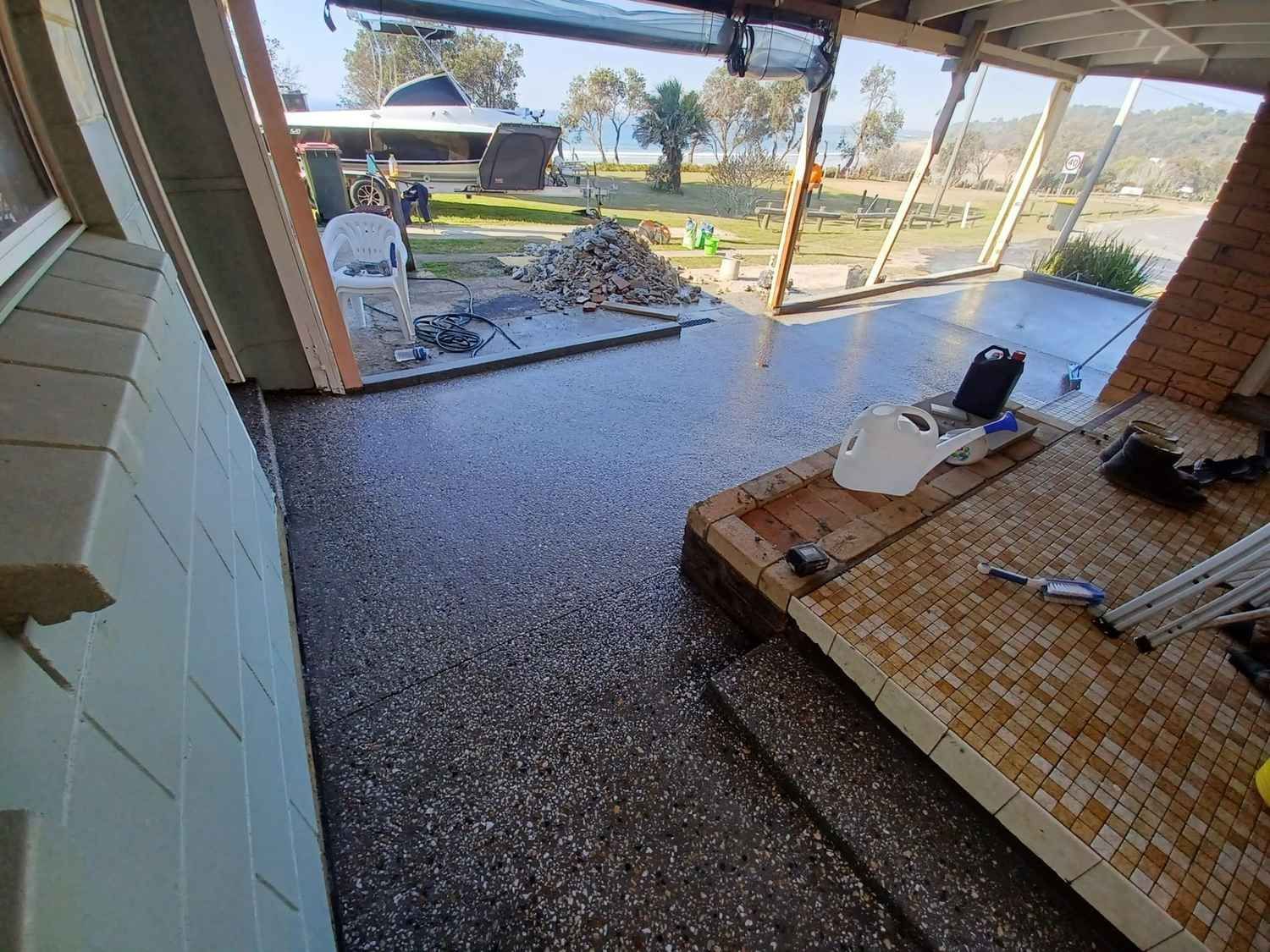 A View of a Patio From Inside a House — Brocksolid Concrete in Pillar Valley, NSW