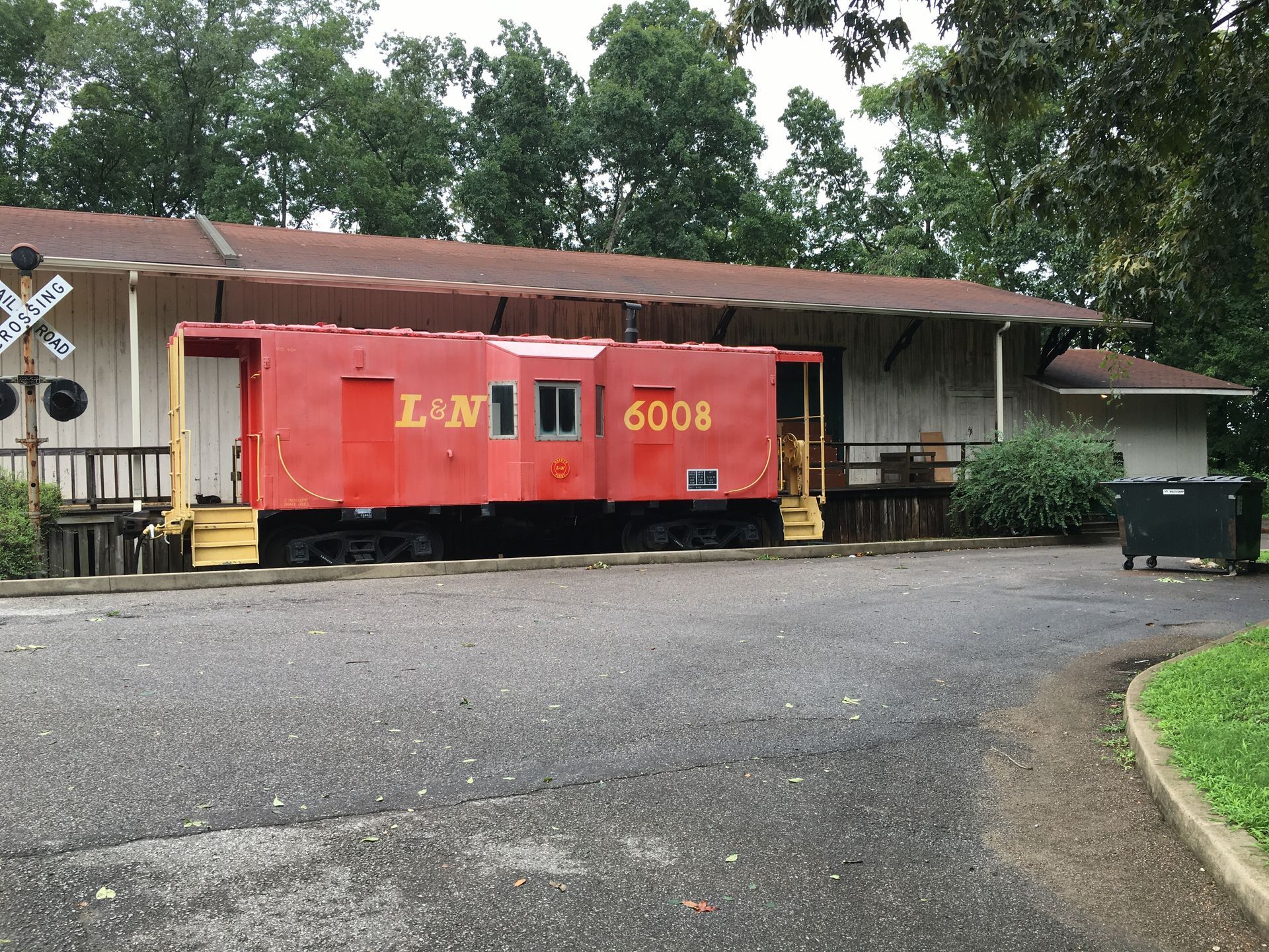 A red train car with the number 6006 on it