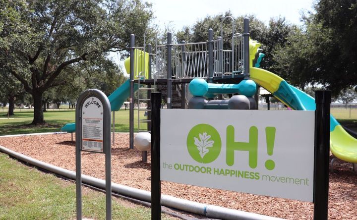 A playground with a sign that says oh on it