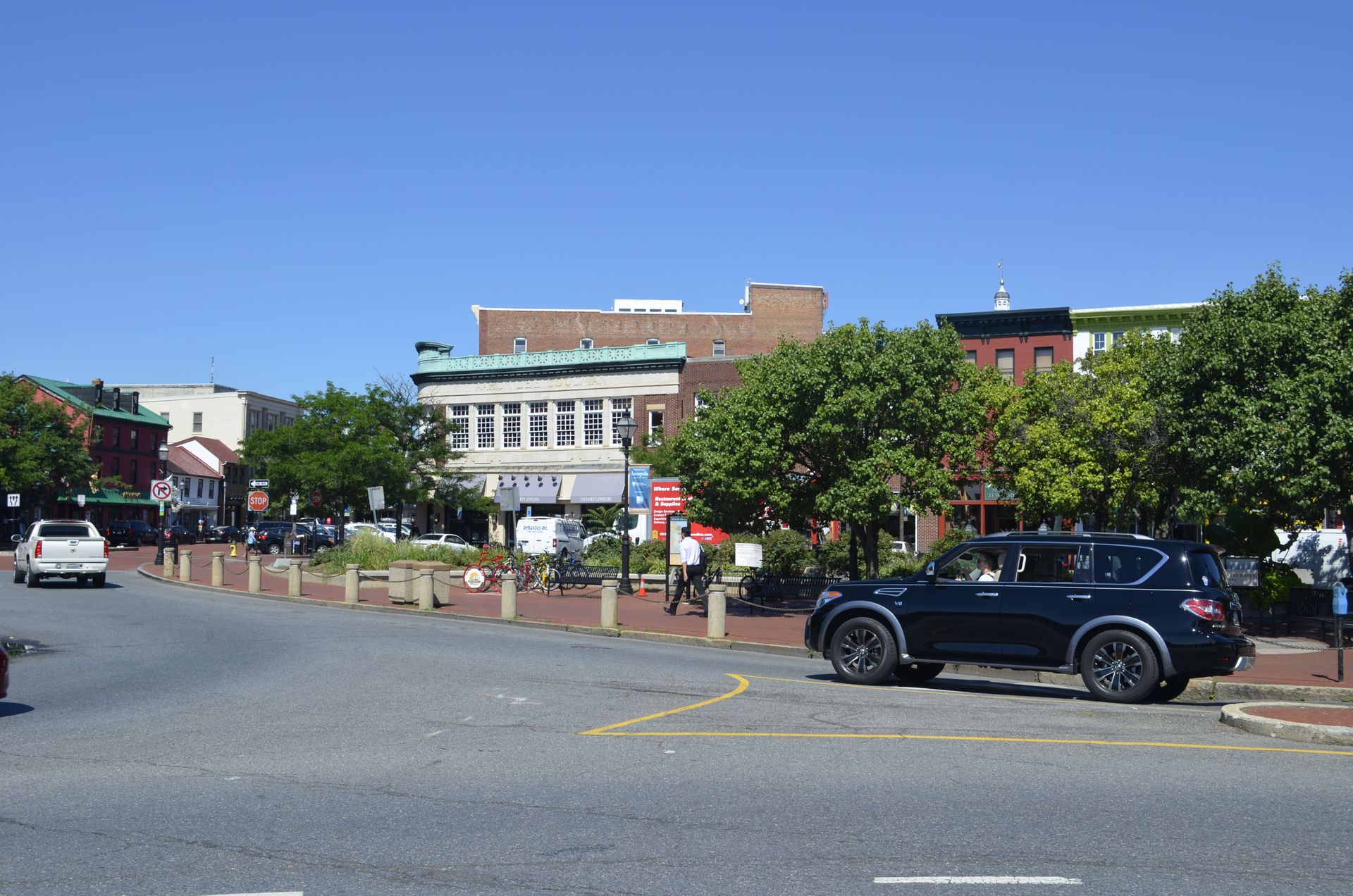 A black suv is parked on the side of the road