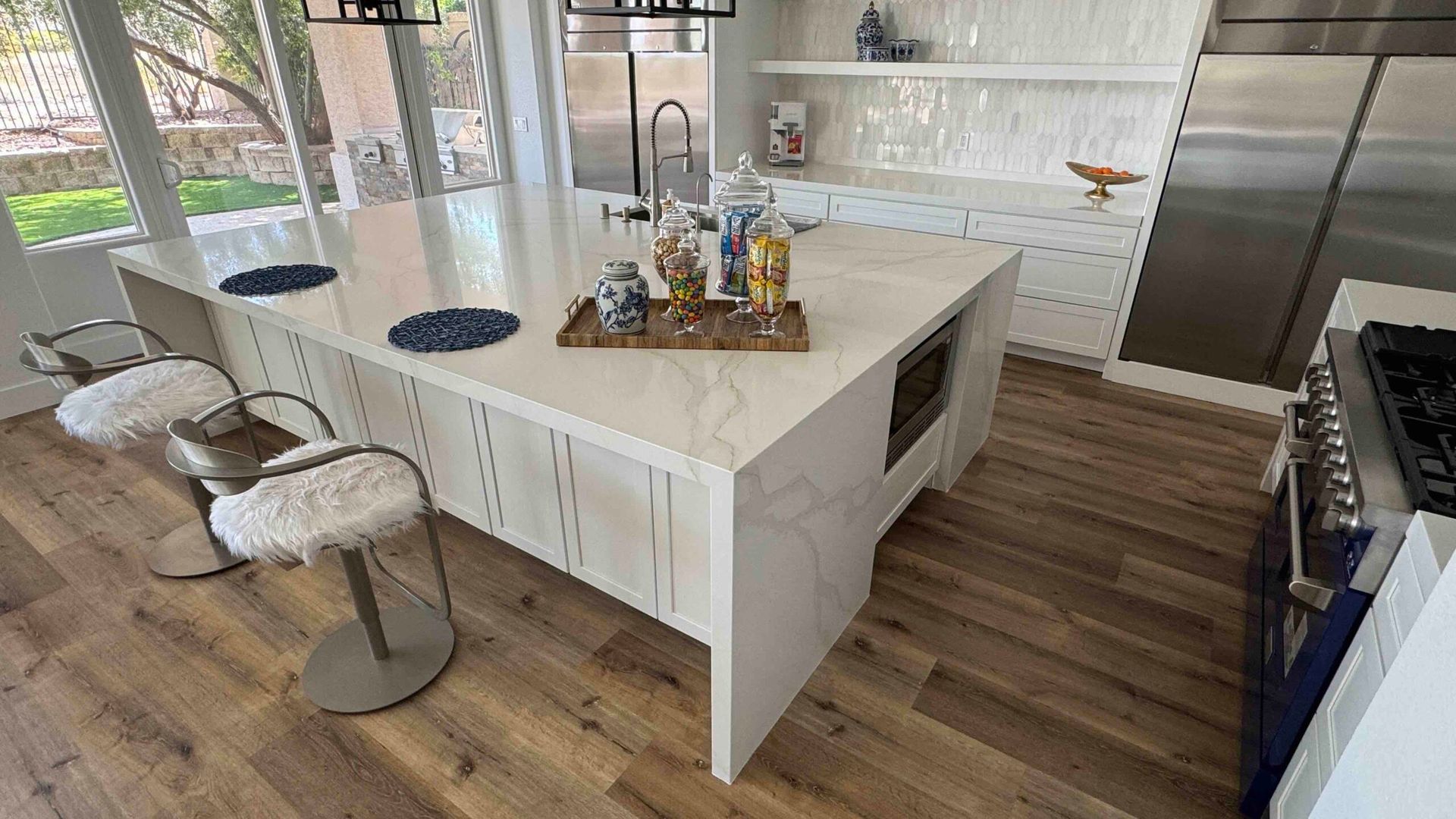 There is a large island in the middle of the kitchen.