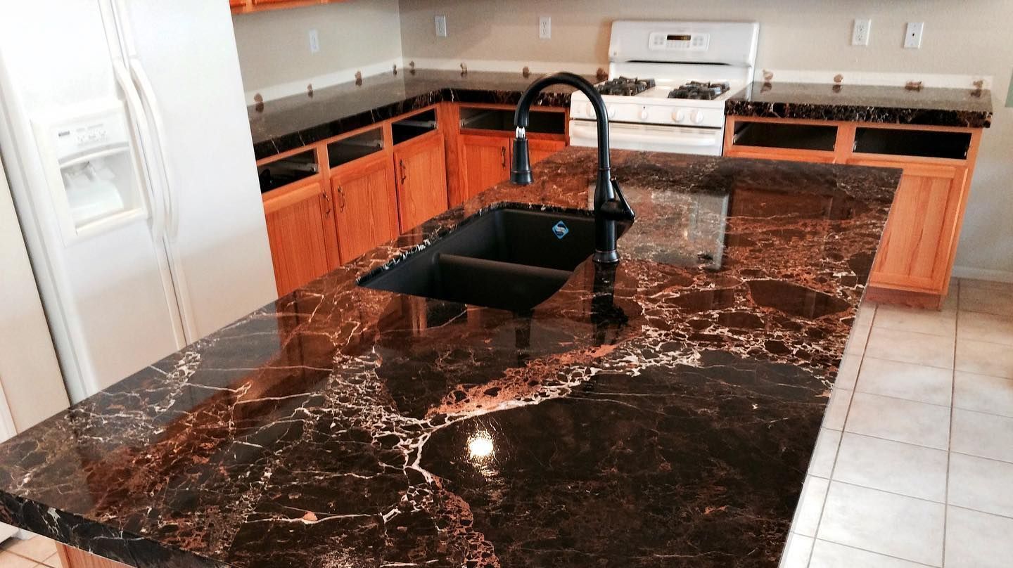 olished marble countertop installation with waterfall edge and custom sink cutout
