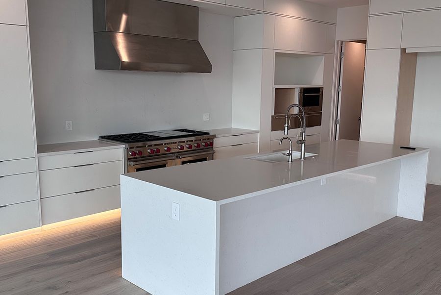 There is a large island in the middle of the kitchen.