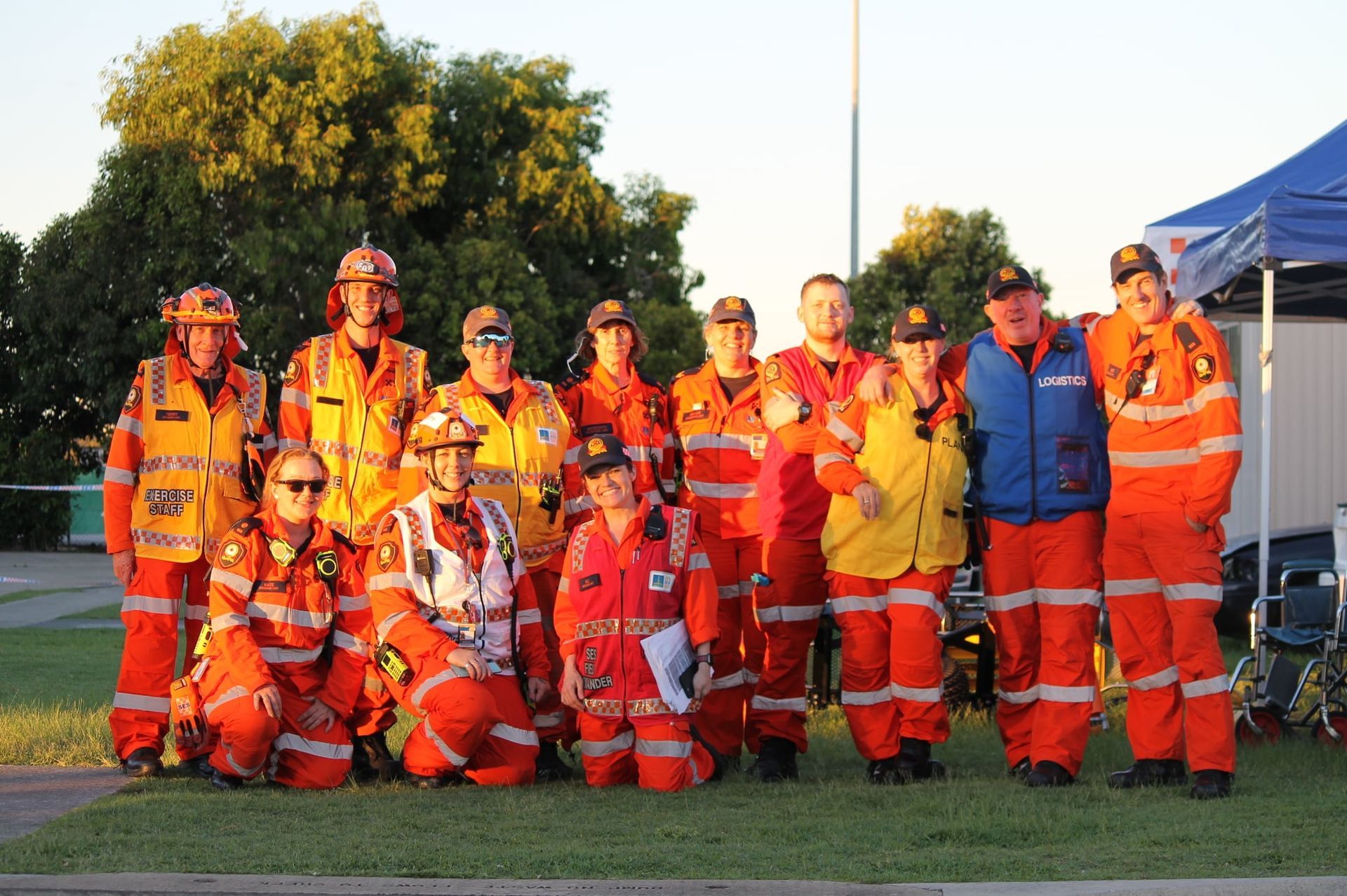 A group of firefighters are posing for a picture together