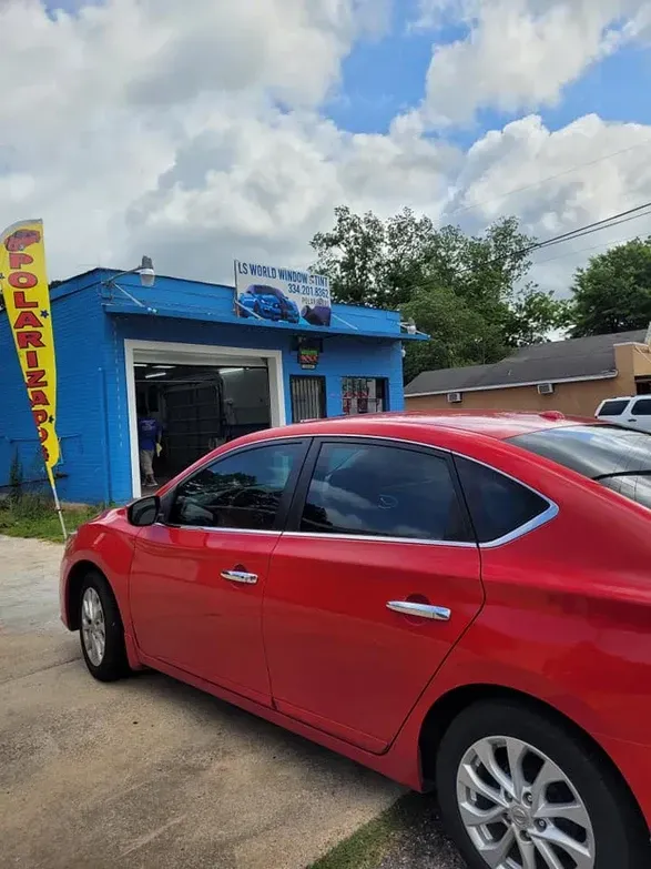 Red Car Outside the Shop — Montgomery, AL — LS World Window Tint