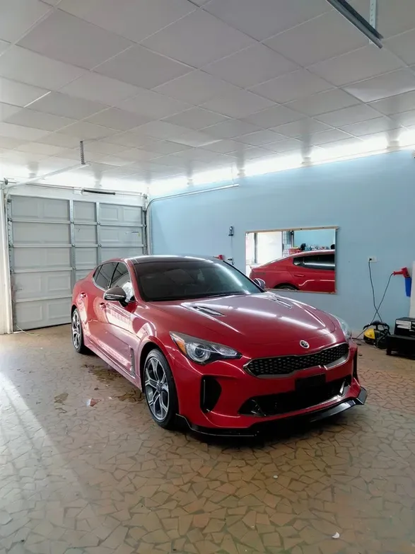 Red Car Inside the Shop Garage — Montgomery, AL — LS World Window Tint