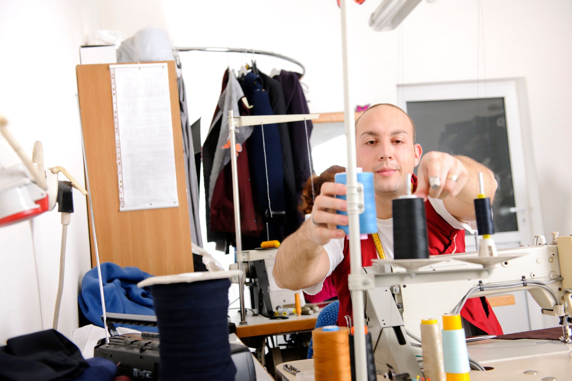 Men Tailor Holding Thread — Wentworthville, NSW — Avesta Tailoring