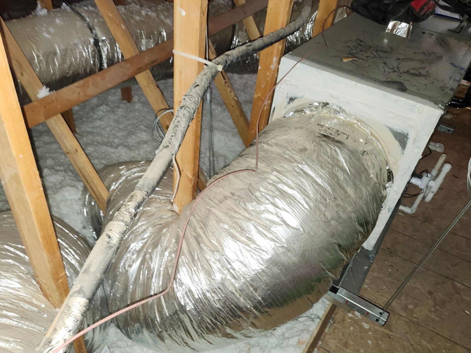 Attic located air handler with no return plenum and poorly routed return duct. impingement causing high static