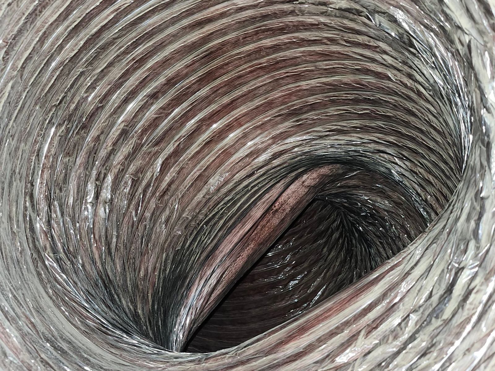 sharp home solutions looking inside return duct that has been reduced in size becuase of poor routing, causing high static pressure