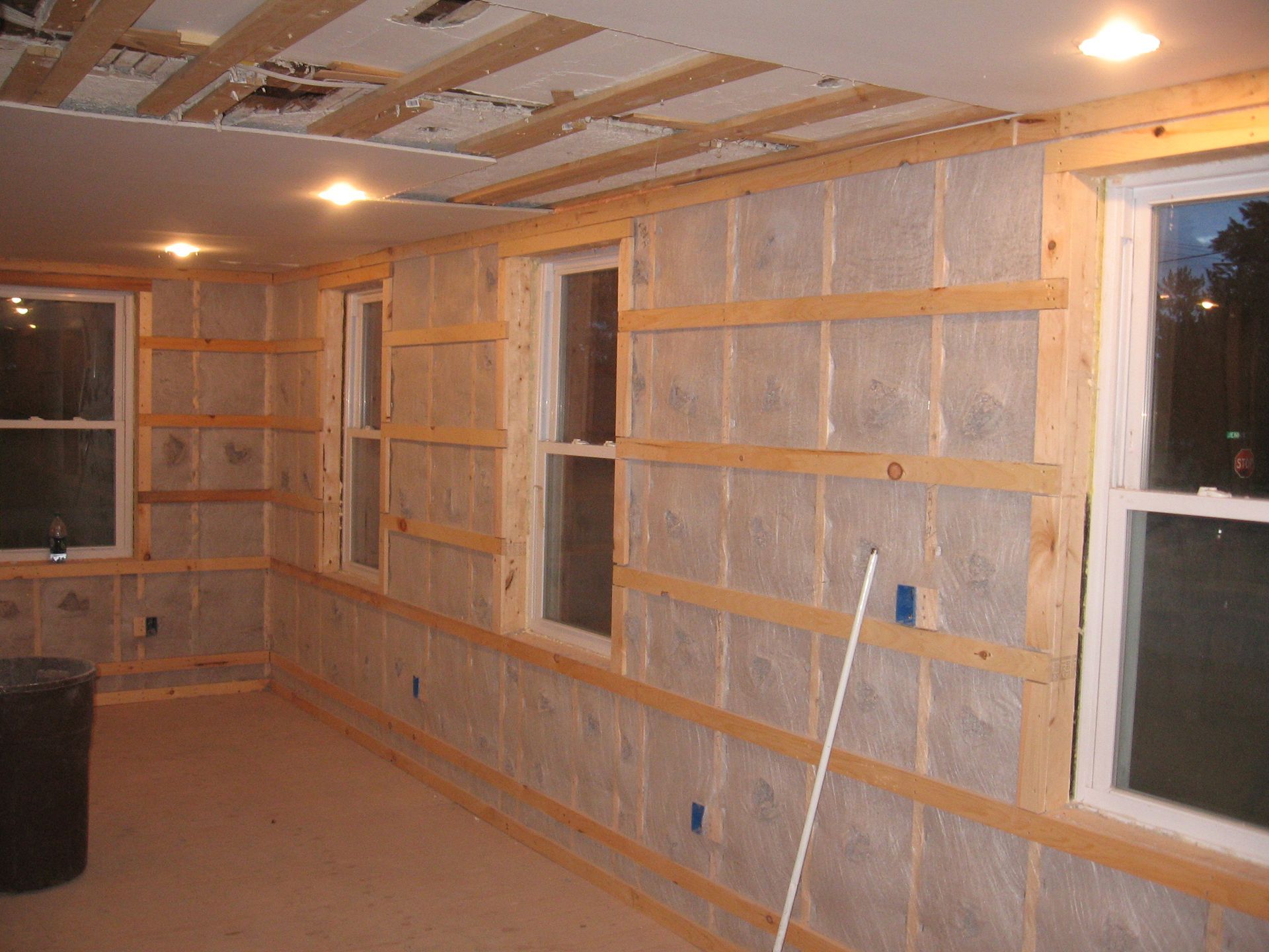 Dense pack cellulose with strapping