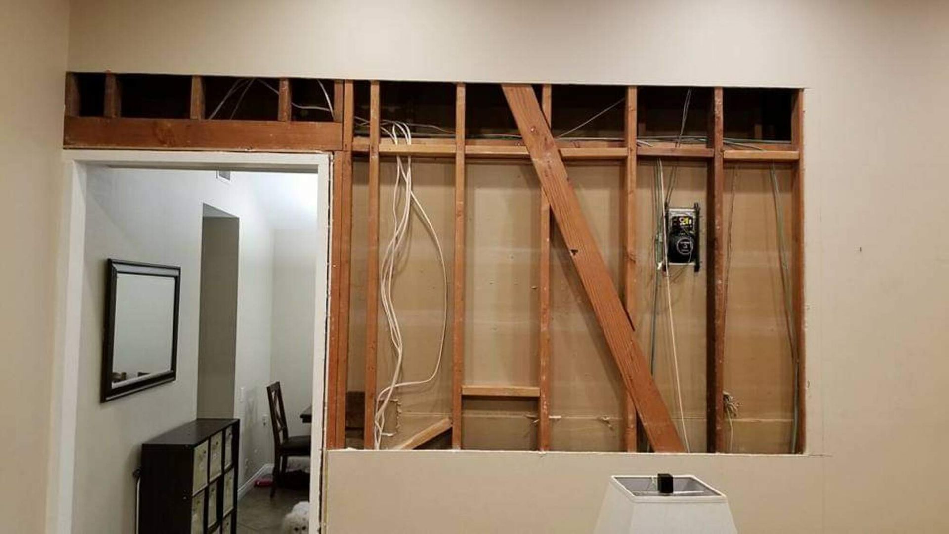 There is a hole in the wall in the middle of the room.