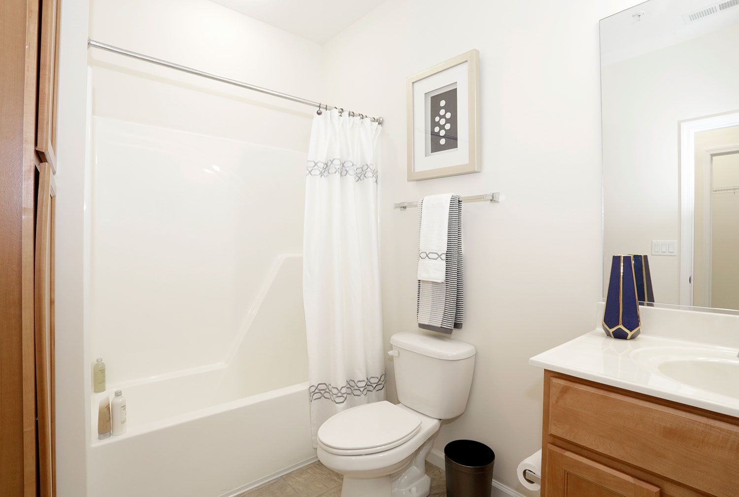 a bathroom with a toilet a sink and a bathtub