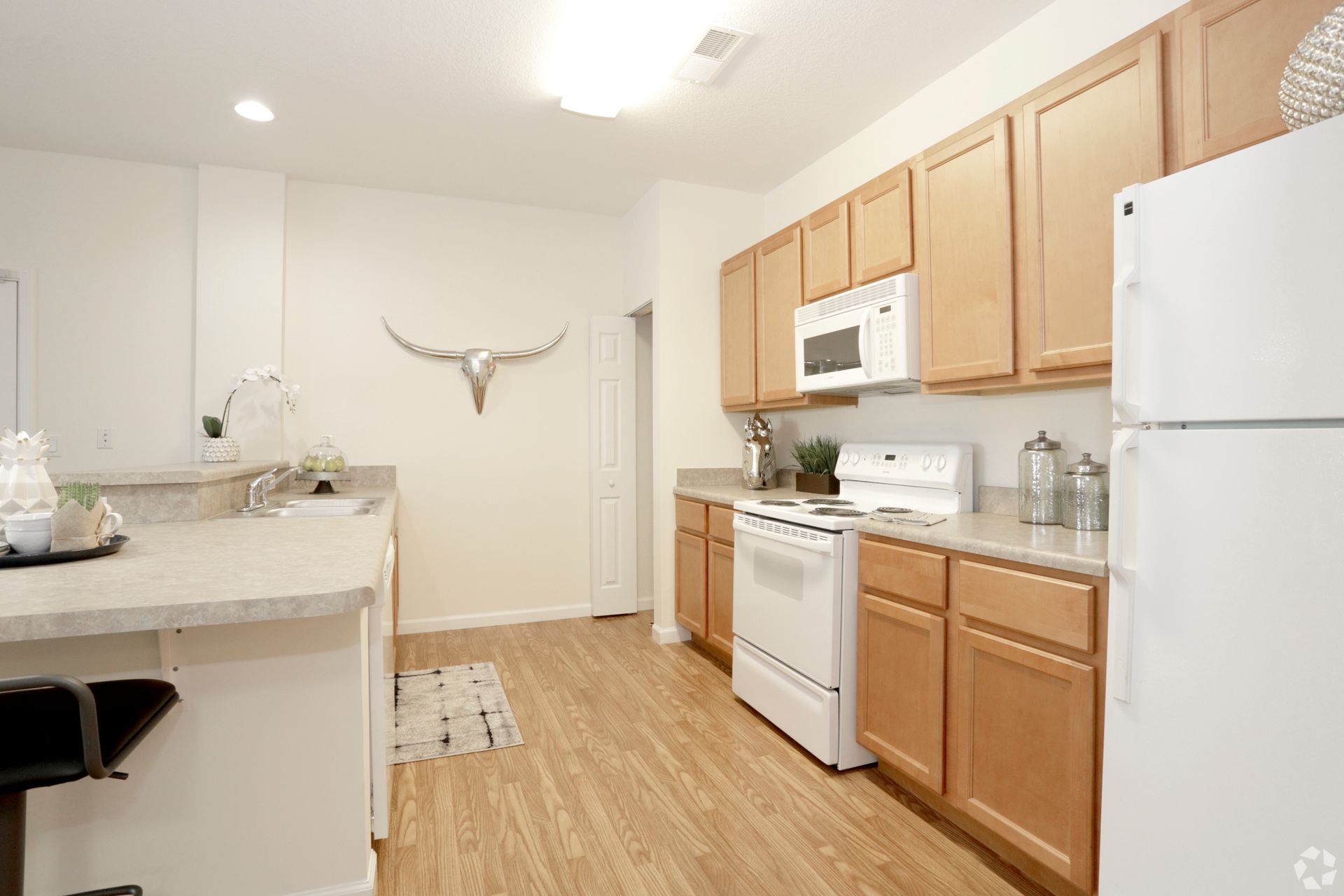 a kitchen with wooden cabinets and a white refrigerator