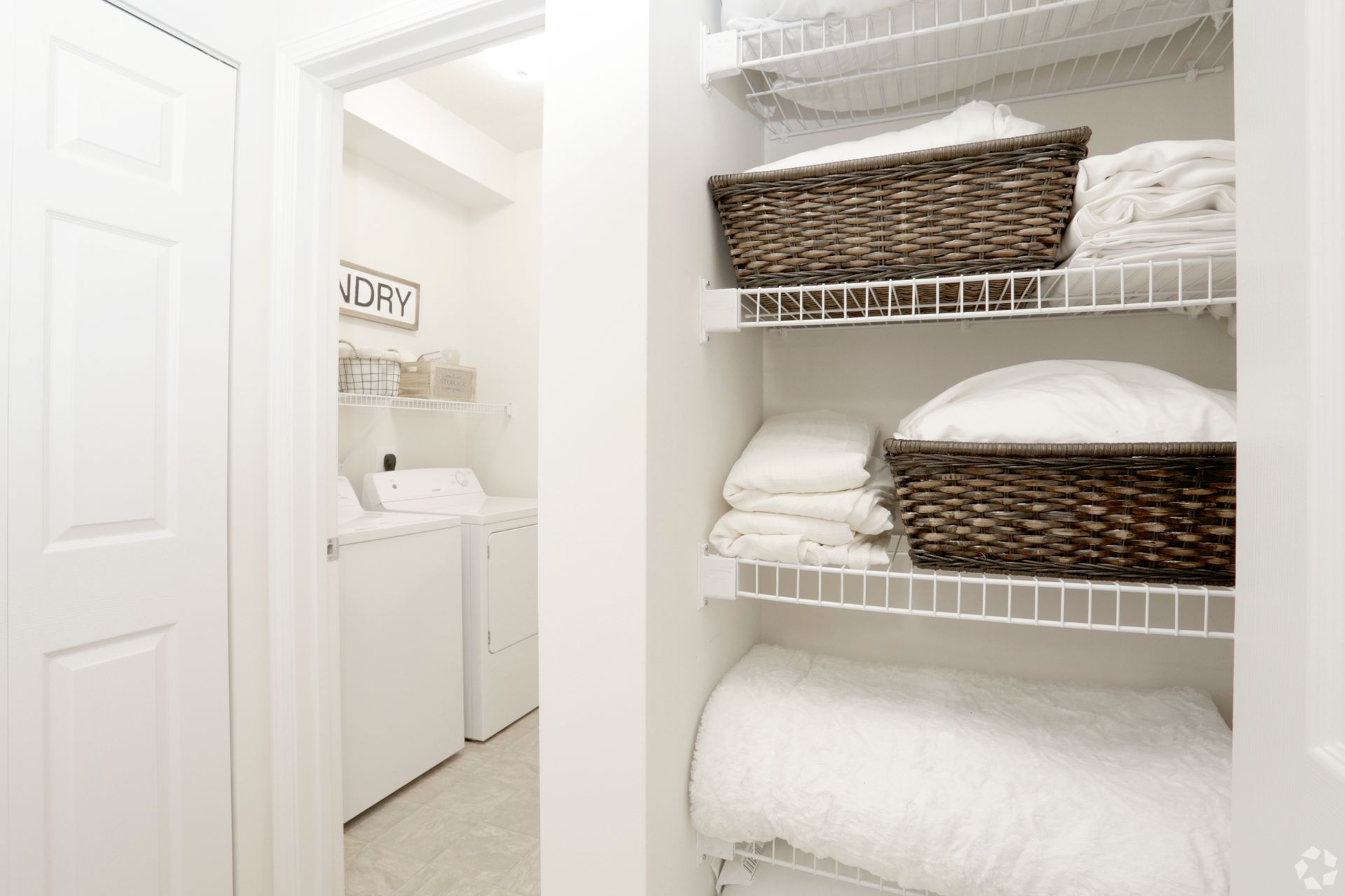 a laundry room with a sign above the door that says laundry