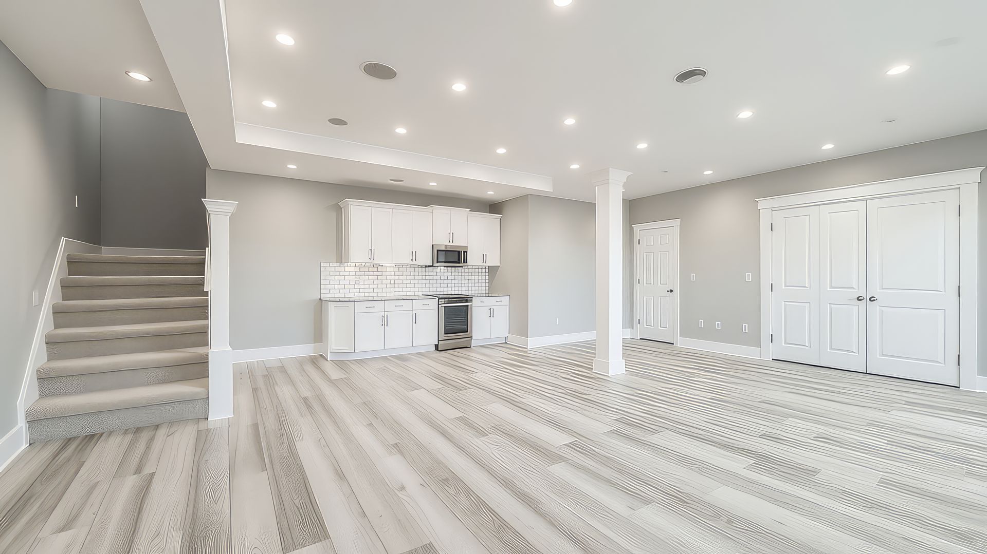 A kitchen with wooden cabinets and black counter tops.