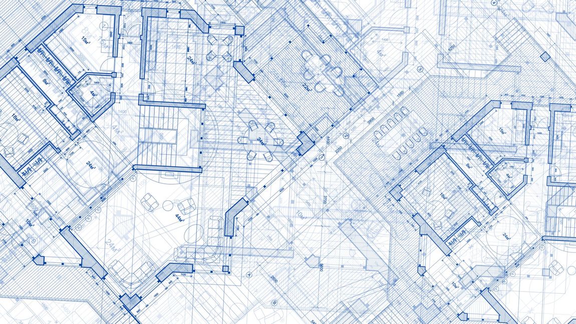 A large empty room with a bar in the middle of it.