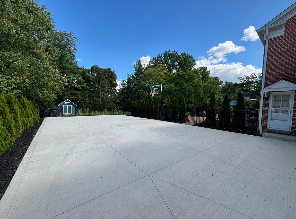 A large empty room with a bar in the middle of it.