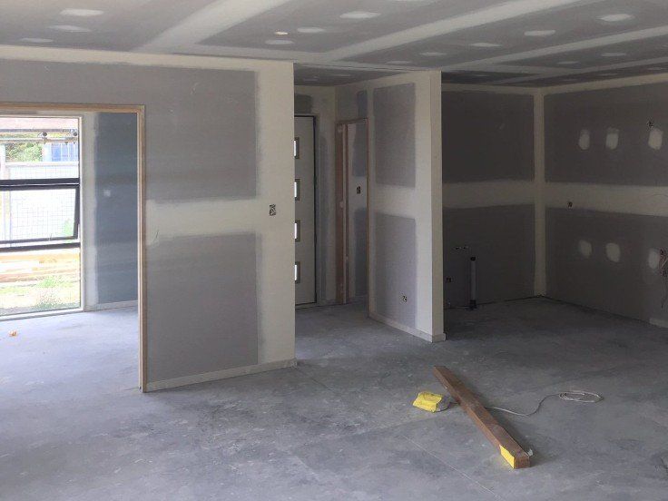 An empty room with a wooden level on the floor