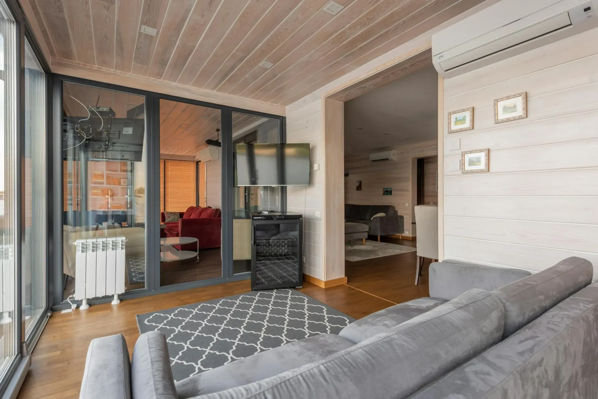 A Person Wearing Gloves is Fixing an Air Conditioner — Gympie Air-Conditioning & Refrigeration In Southside, QLD