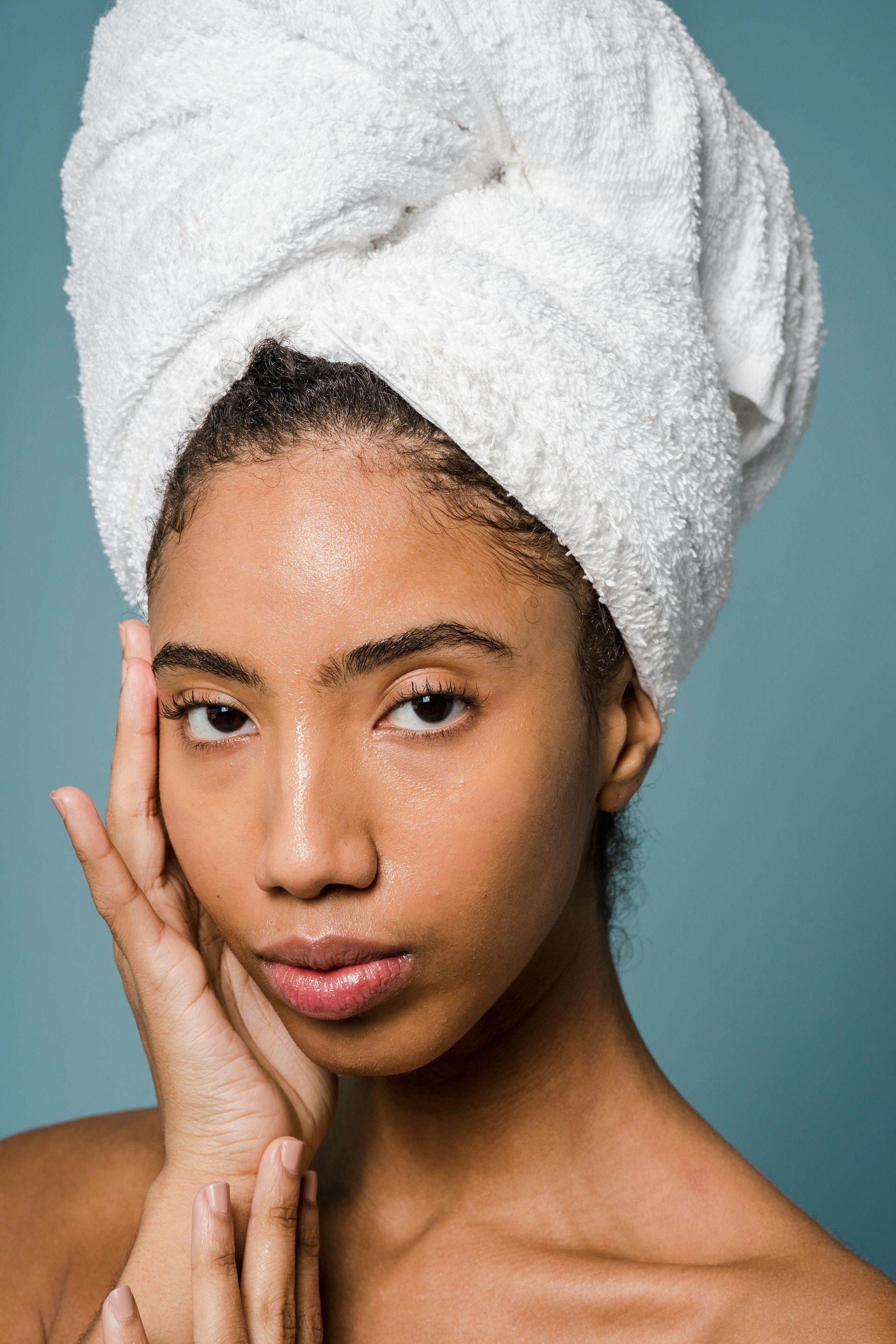 A woman with a towel wrapped around her head.