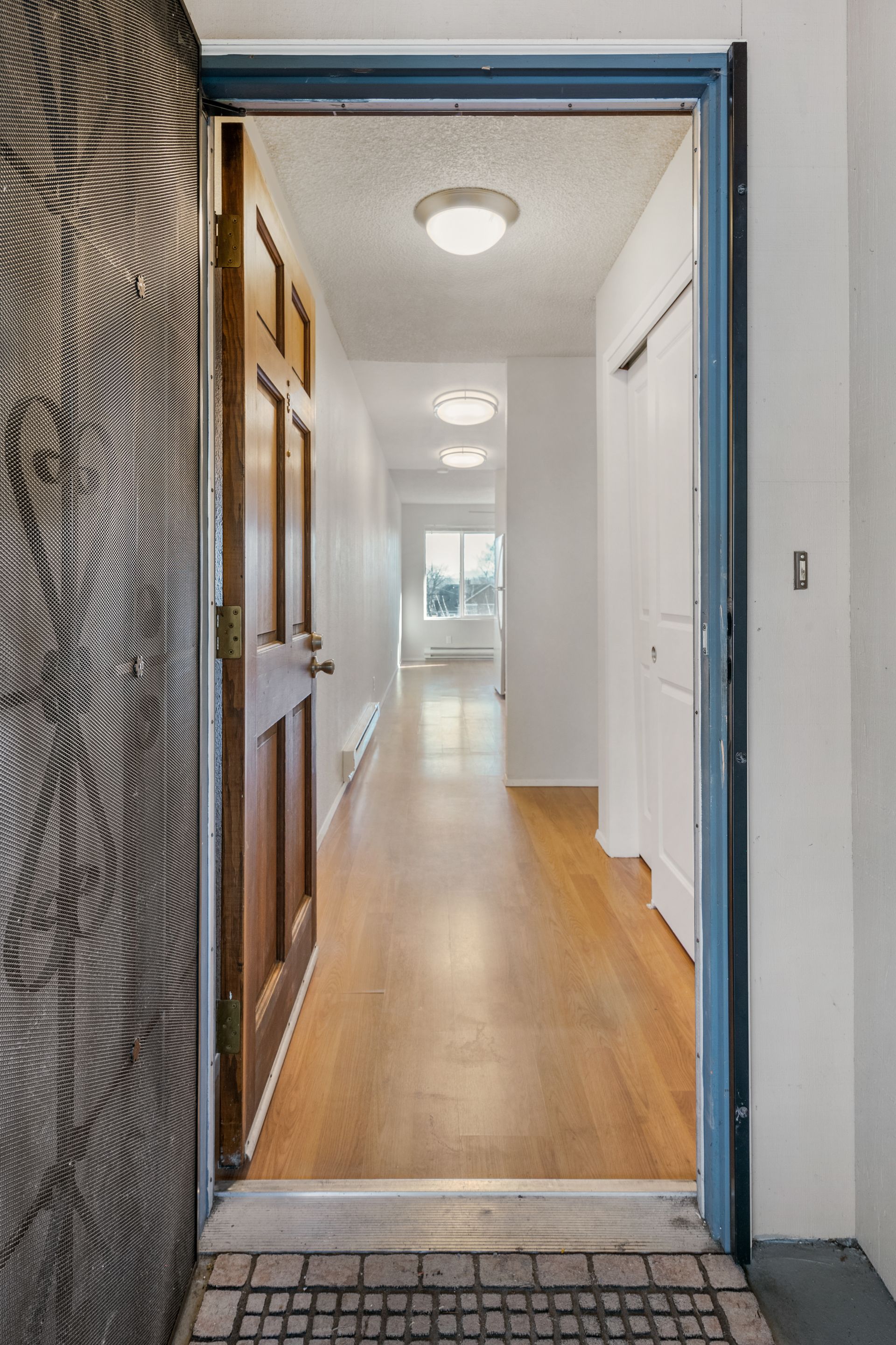 Photo showing the point of view of someone walking in through the front door, with a hallway