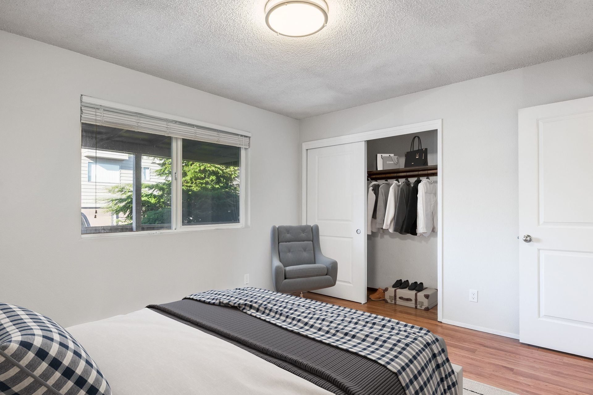 Photo showing a bedroom with a sliding door closet