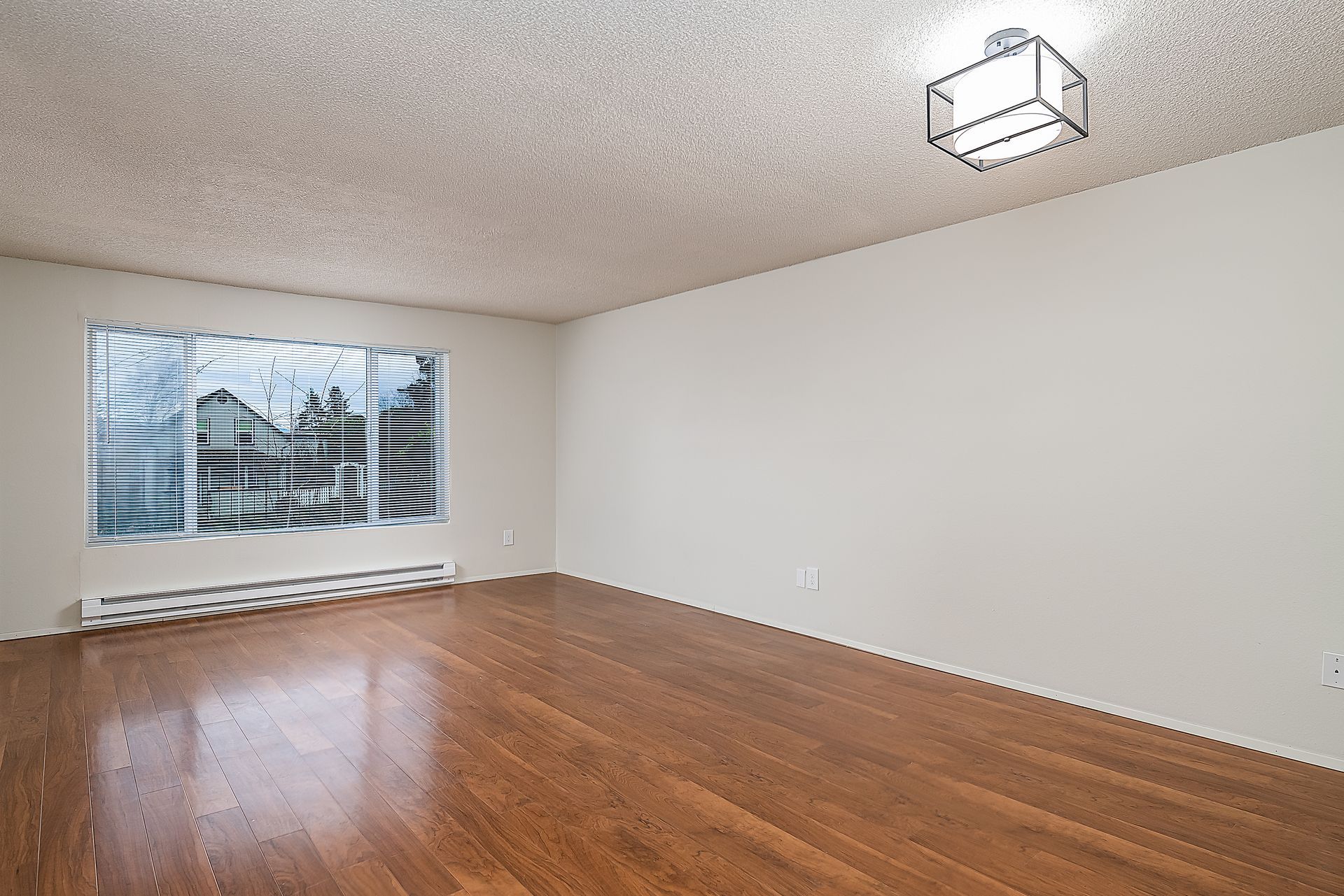 Photo showing a large room with a very large window