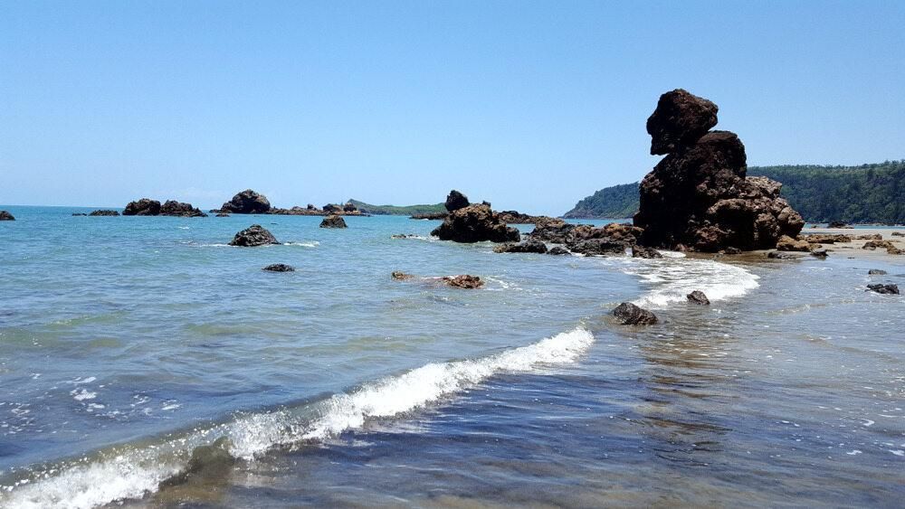 A Large Rock In The Middle Of A Body Of Water — David Lewis Solahart in Ocean Shores, NSW