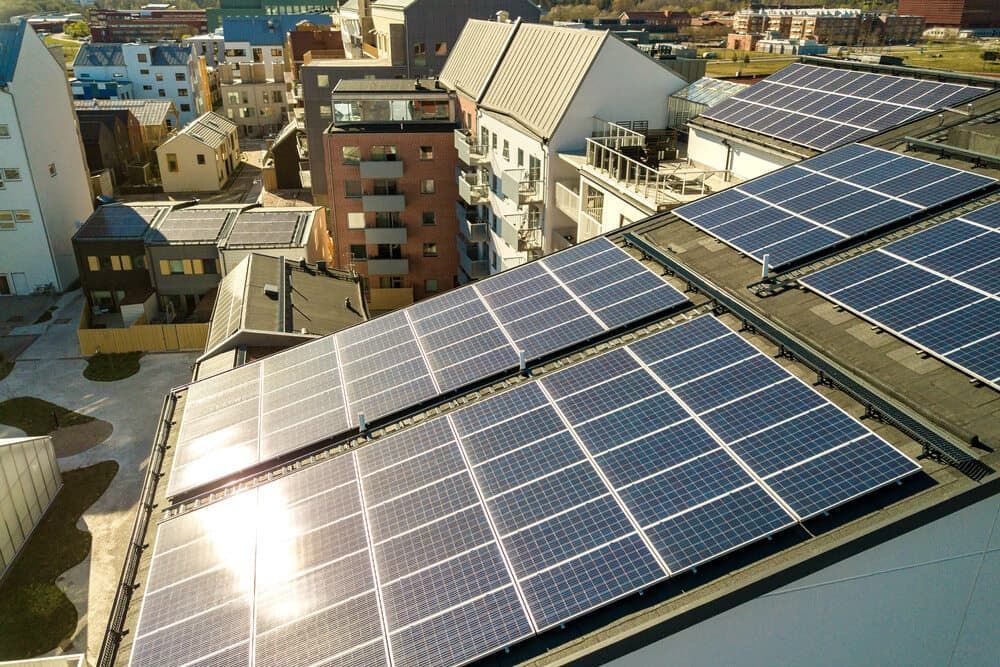 A Bunch Of Solar Panels On The Roof Of A Building — David Lewis Solahart in Kyogle, NSW