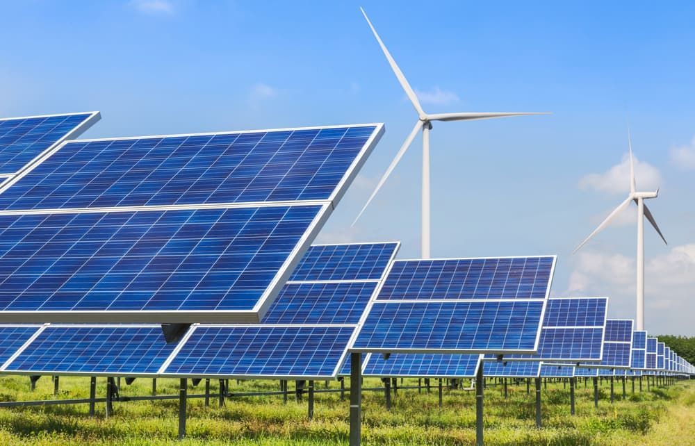 A Row Of Solar Panels And Wind Turbines In A Field — David Lewis Solahart in Murwillumbah, NSW