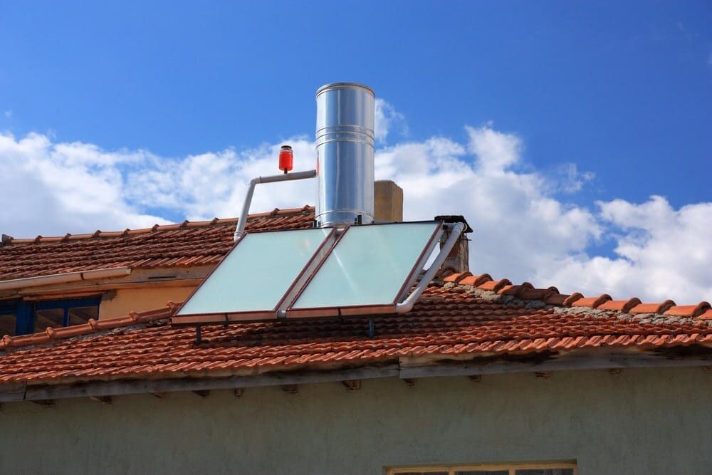 A Solar Panel On The Roof Of A House With Chimney — David Lewis Solahart in Evans Head, NSW